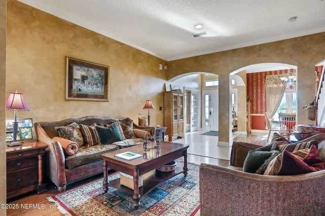 a kitchen with stainless steel appliances granite countertop a sink a stove and refrigerator