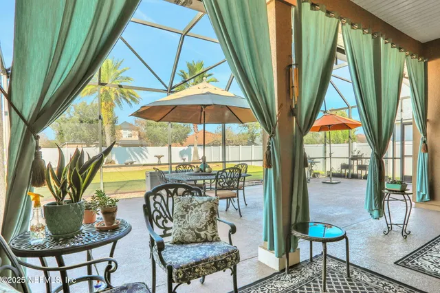 an aerial view of a house with swimming pool