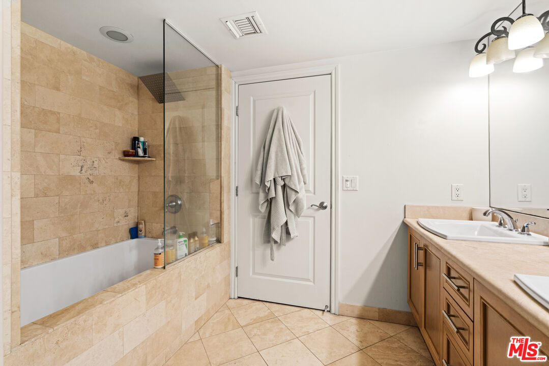 8238 West Manchester Avenue, Unit 204 Playa del Rey, CA 90293 - Photo 15 of 23 a bathroom with a tub sink and mirror