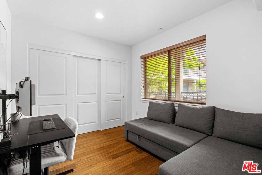 8238 West Manchester Avenue, Unit 204 Playa del Rey, CA 90293 - Photo 16 of 23 a living room with furniture and a window