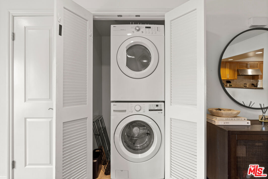 8238 West Manchester Avenue, Unit 204 Playa del Rey, CA 90293 - Photo 17 of 23 a view of a hallway with washer and dryer