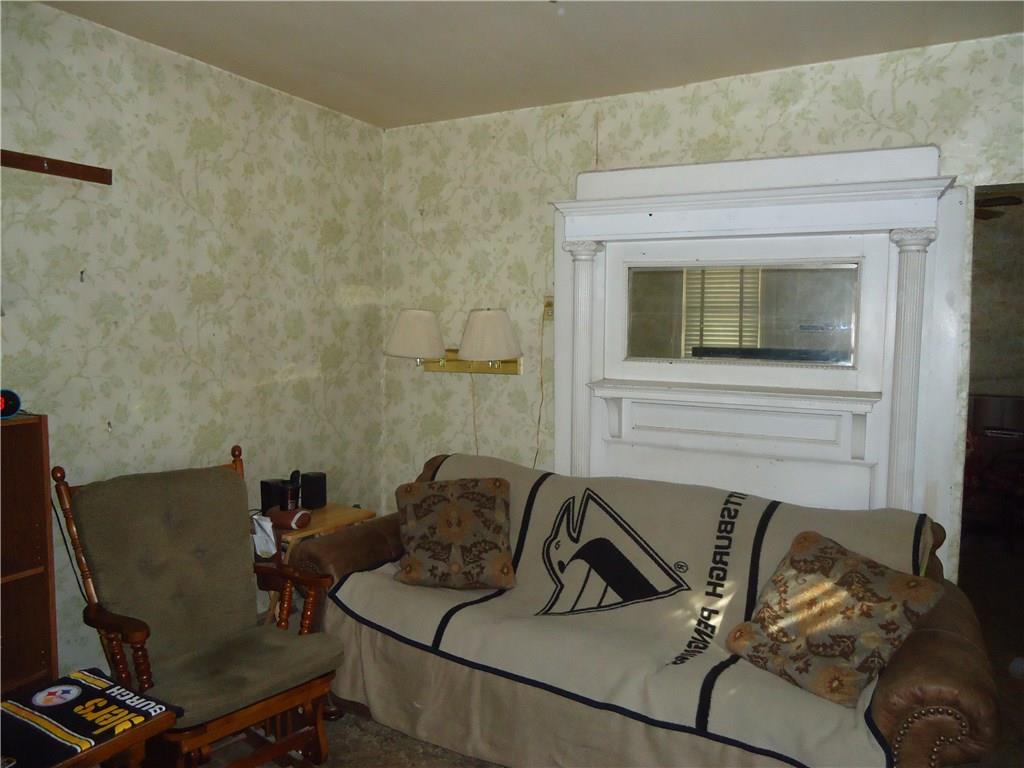 515 Jefferson Street Rochester, PA 15074 - Photo 5 of 24 Living room with decorative fireplace.