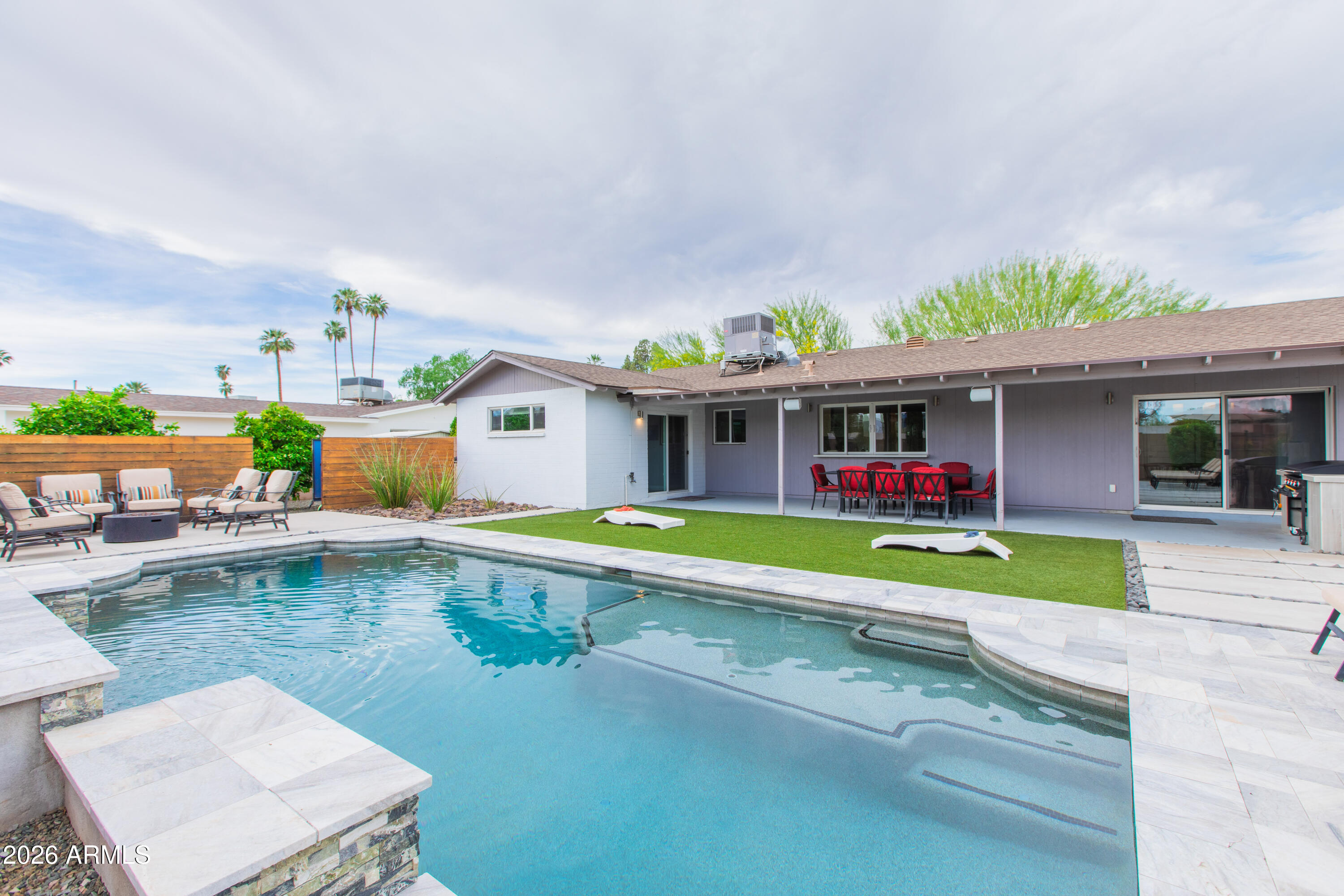 5541 East Cheery Lynn Road Phoenix, AZ 85018 - Photo 63 of 69 swimming pool with outdoor seating and yard