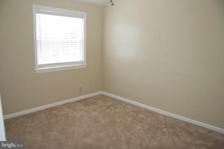 1949 Quentin Road Dundalk, MD 21222 - Photo 16 of 21 an empty room with a window