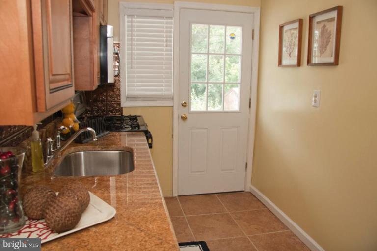 1949 Quentin Road Dundalk, MD 21222 - Photo 8 of 21 a bathroom with a sink and a mirror