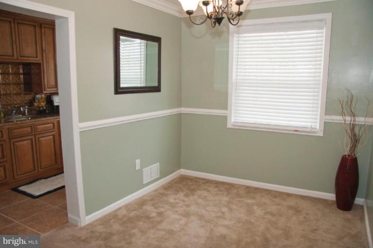 1949 Quentin Road Dundalk, MD 21222 - Photo 9 of 21 a view of empty room with window and cabinet