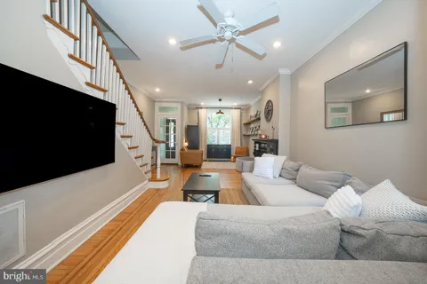 a living room with furniture and a flat screen tv