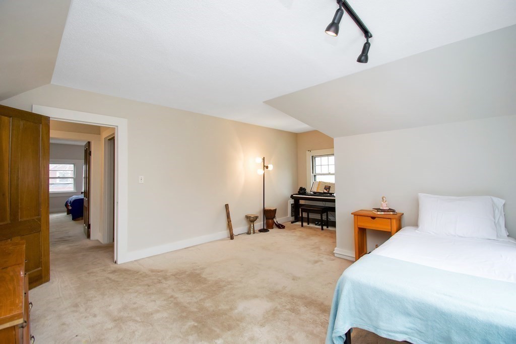 59 Fairfield Street Springfield, MA 01108 - Photo 32 of 42 a bedroom with a bed and cabinets