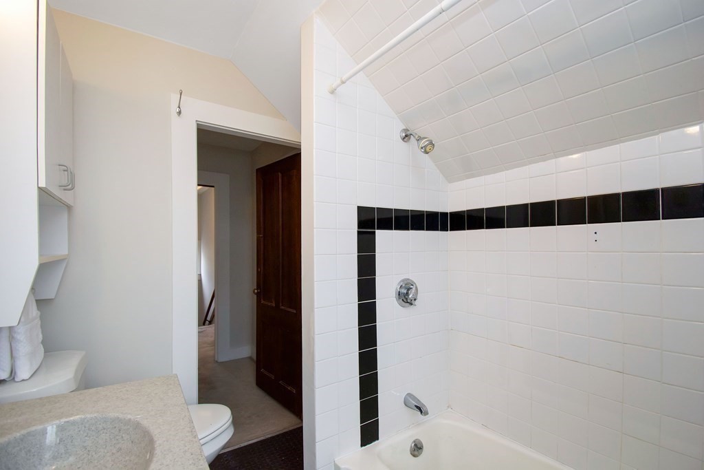 59 Fairfield Street Springfield, MA 01108 - Photo 34 of 42 a bathroom with a shower a toilet and a sink