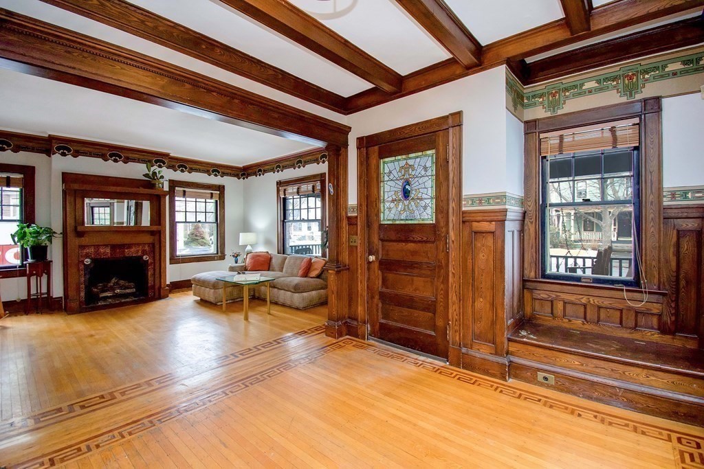 59 Fairfield Street Springfield, MA 01108 - Photo 6 of 42 a living room with furniture a fireplace and large windows