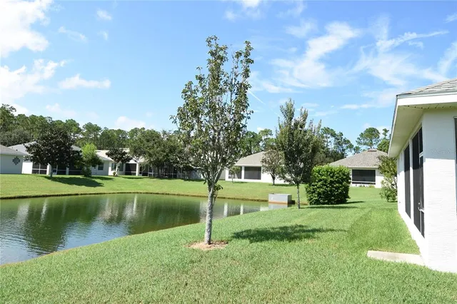 a view of a garden with a lake view