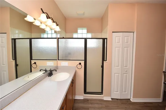 a bathroom with a sink and mirror