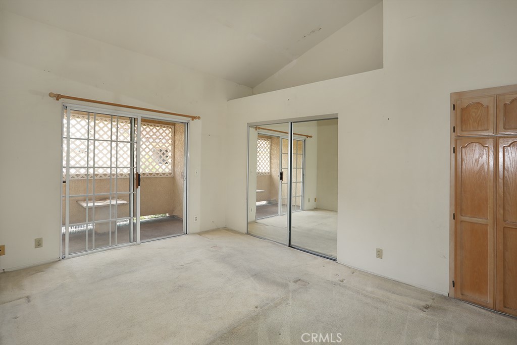 8032 Rose Street, Unit 13 Paramount, CA 90723 - Photo 13 of 25 an empty room with windows