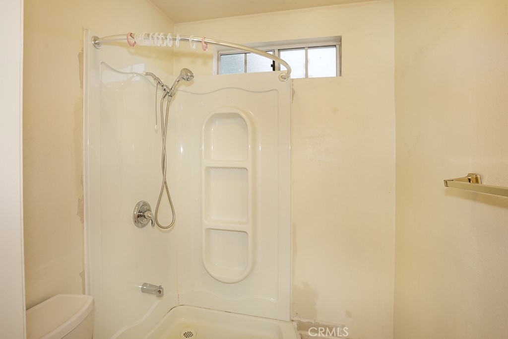 8032 Rose Street, Unit 13 Paramount, CA 90723 - Photo 16 of 25 a bathroom with a shower
