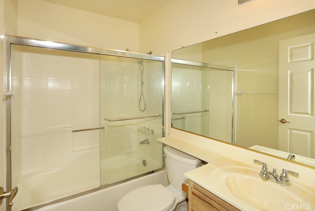 8032 Rose Street, Unit 13 Paramount, CA 90723 - Photo 19 of 25 a bathroom with a sink toilet and shower