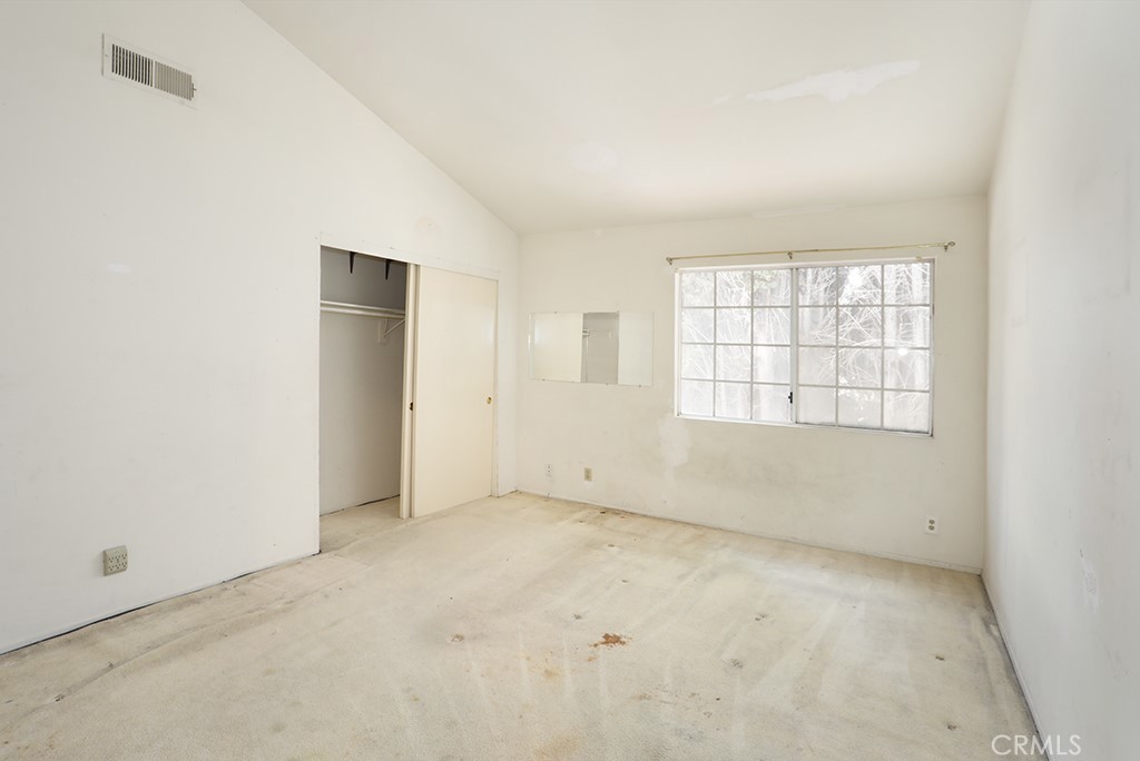 8032 Rose Street, Unit 13 Paramount, CA 90723 - Photo 20 of 25 an empty room with windows