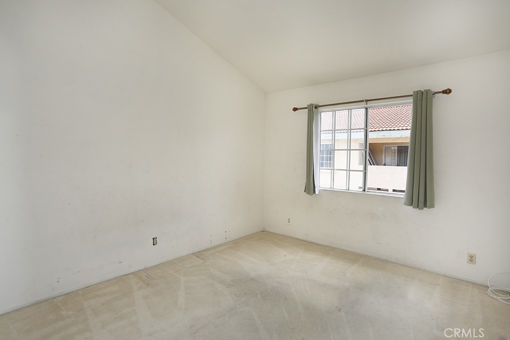 8032 Rose Street, Unit 13 Paramount, CA 90723 - Photo 22 of 25 an empty room with a window