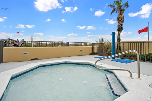 a view of a swimming pool and outdoor seating