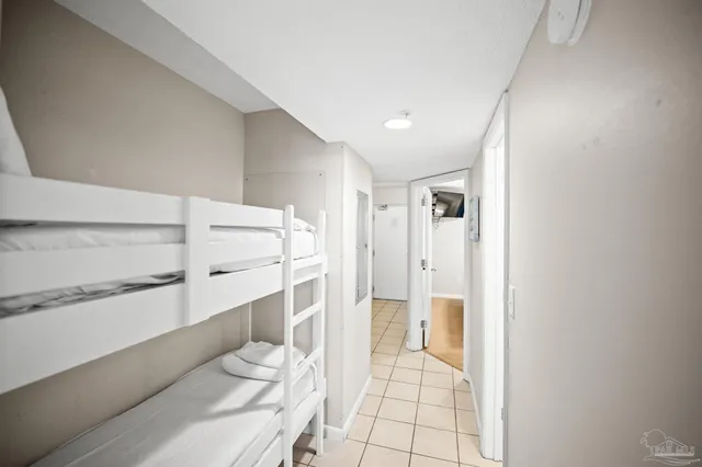 a bathroom with a sink mirror and shower