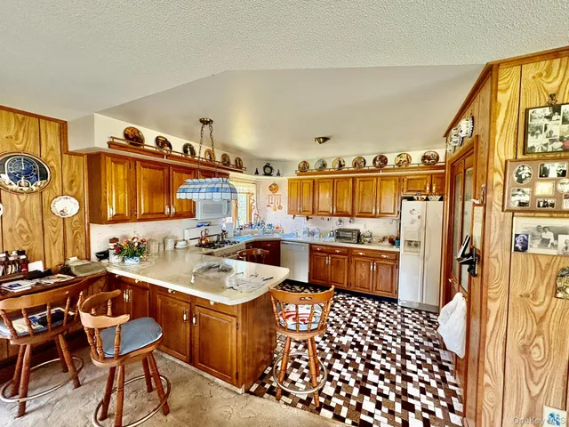 a bathroom with a sink a mirror and a shower