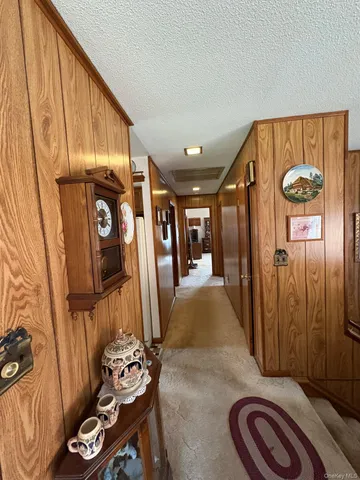 a view of entryway with furniture and livingroom view