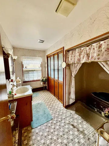 a view of room with window and furniture