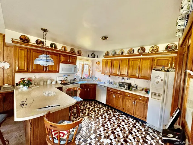 a kitchen with stainless steel appliances a sink and a refrigerator