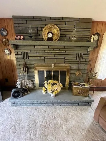 a living room with furniture and fireplace