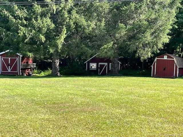 a house view with a sitting space and garden