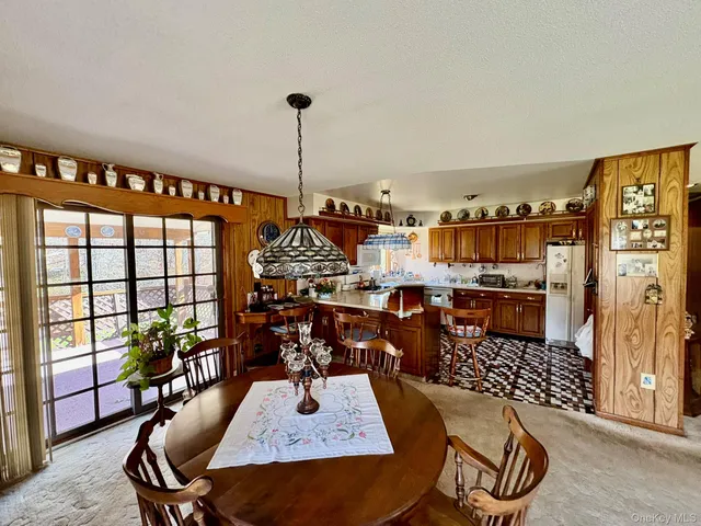 a view of a dining room with furniture
