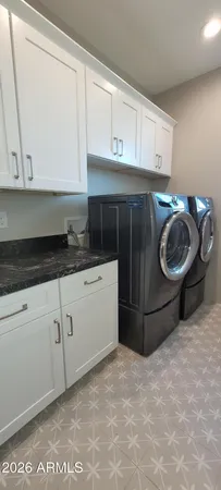 a kitchen with a stove and cabinets