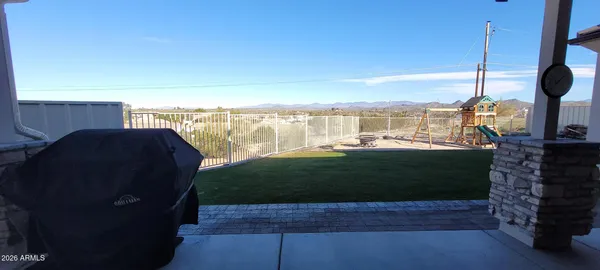 a view of a yard from a balcony
