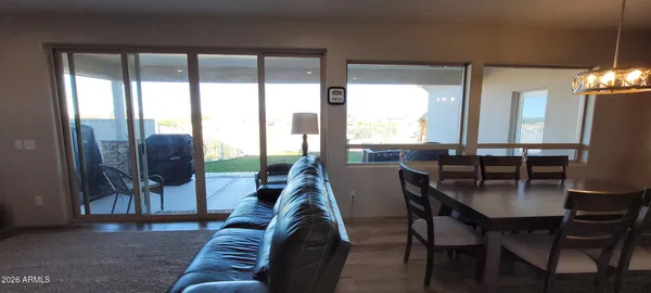 a view of a dining room with furniture window and outside view