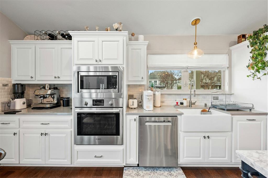 2802 Warren Street, Unit A Austin, TX 78703 - Photo 11 of 29 a kitchen with cabinets and white appliances
