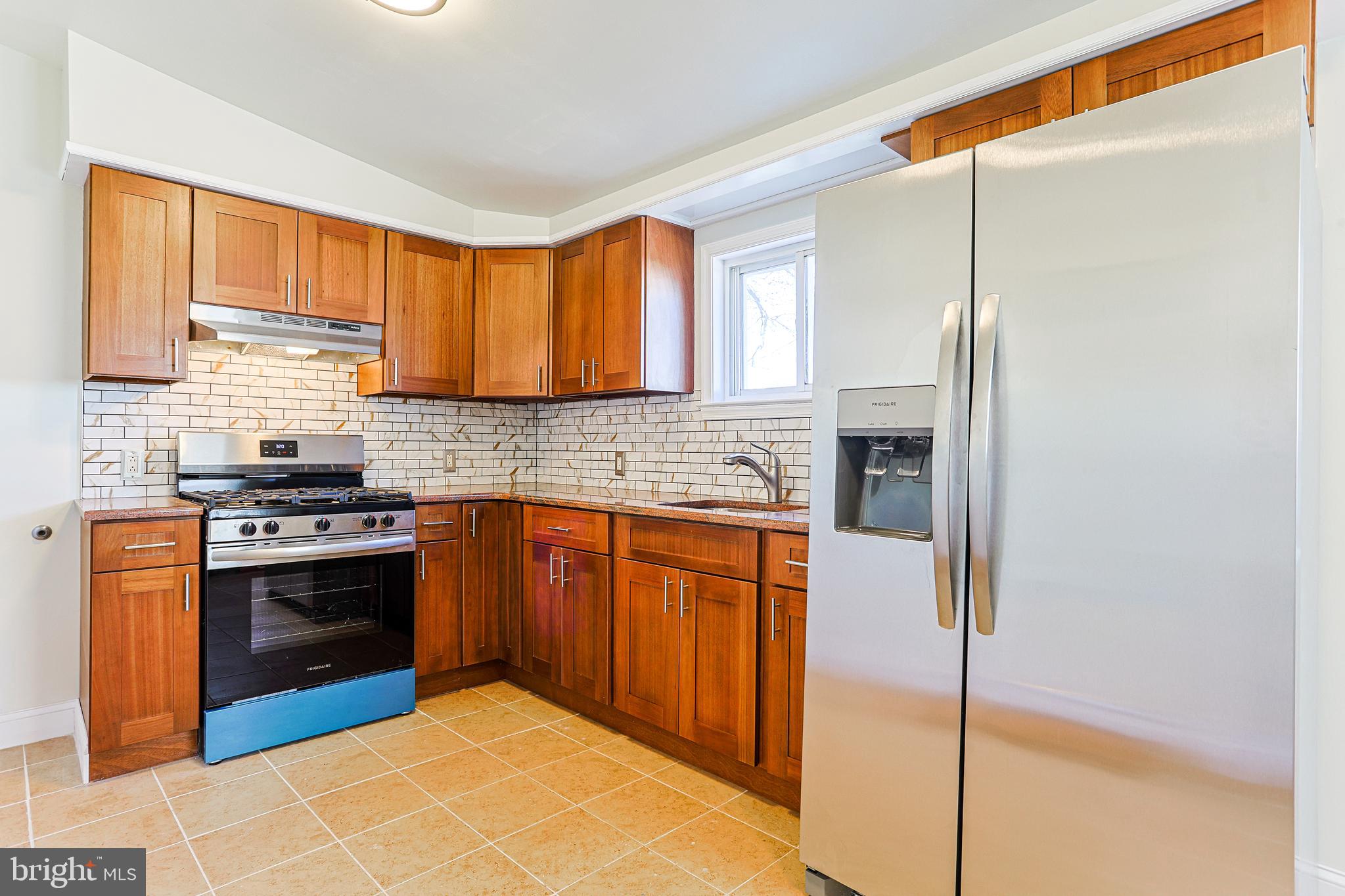 349 South Springfield Road Clifton Heights, PA 19018 - Photo 1 of 40 a kitchen with stainless steel appliances granite countertop a stove a sink and a refrigerator