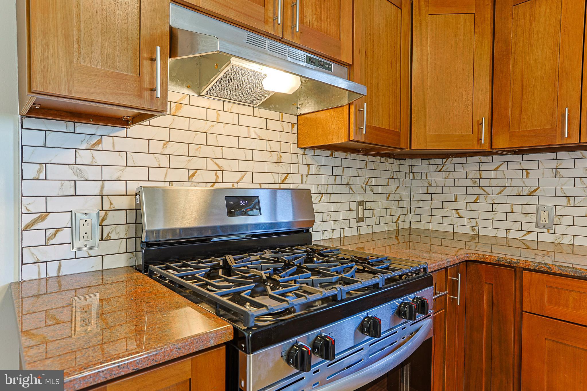 349 South Springfield Road Clifton Heights, PA 19018 - Photo 4 of 40 a stove top oven sitting inside of a kitchen