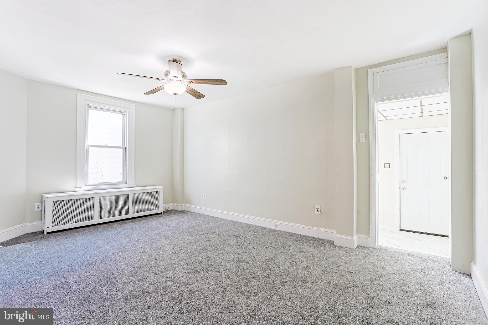 349 South Springfield Road Clifton Heights, PA 19018 - Photo 8 of 40 an empty room with chandelier fan and windows