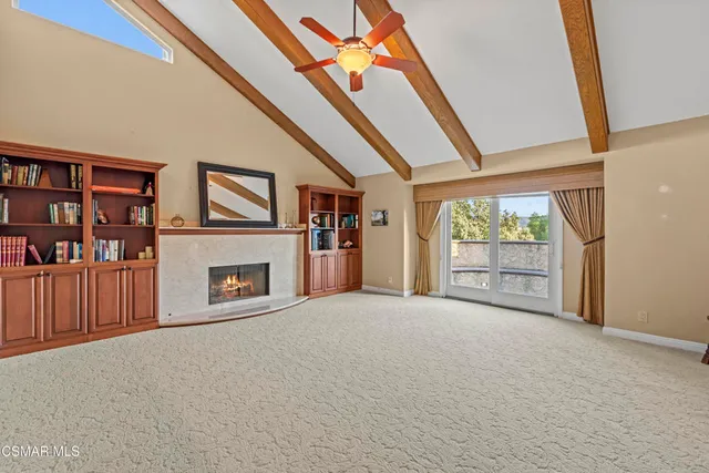 a kitchen with stainless steel appliances granite countertop a stove a sink dishwasher and a refrigerator with wooden cabinets