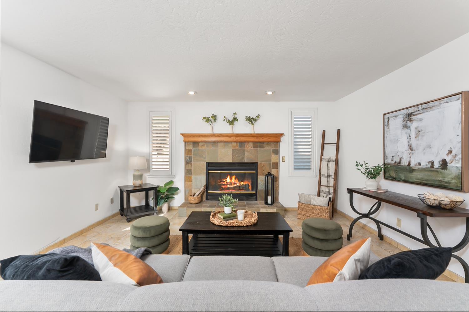 a living room with furniture and a fireplace