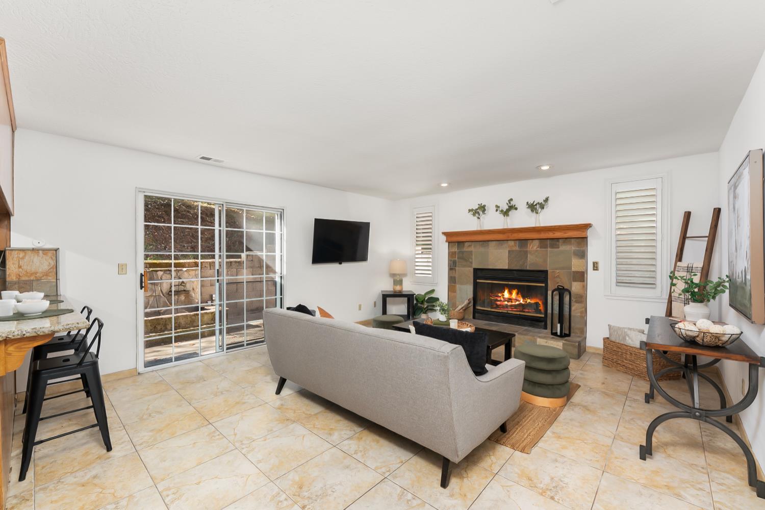 2960 Pasada Road Cameron Park, CA 95682 - Photo 14 of 40 a living room with furniture a fireplace and a flat screen tv