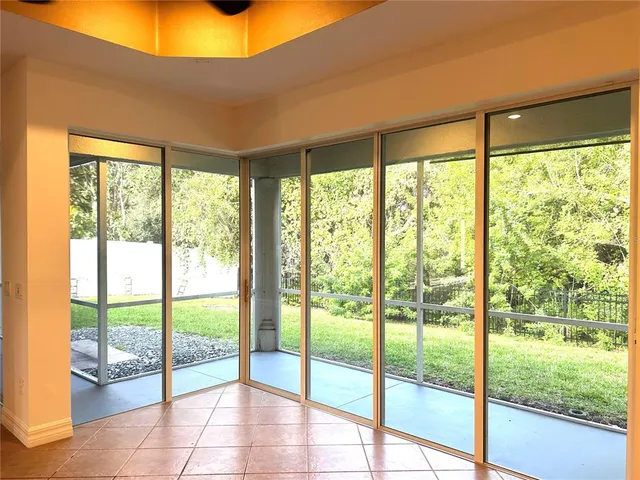 a view of a hallway with a chandelier