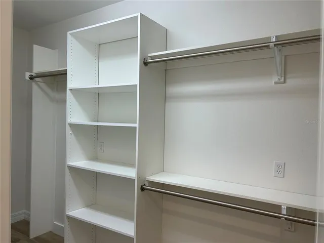a bathroom with a shower sink and mirror