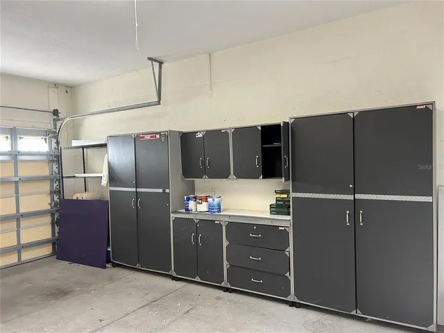 a view of a chairs and table in a patio