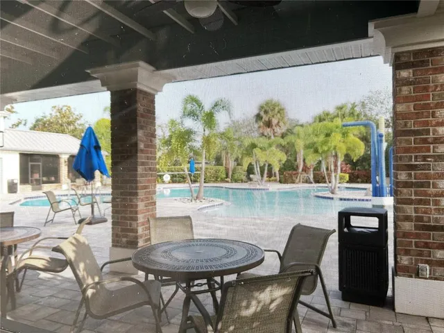 a view of a swimming pool with a patio