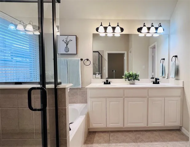 a spacious bathroom with a double vanity sink mirror and