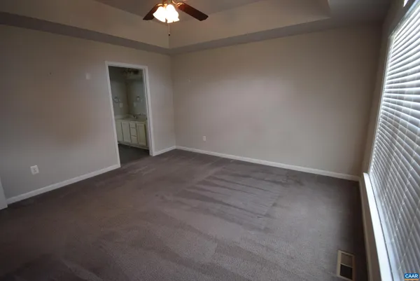 an empty room with a empty space and a window