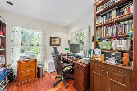 a room with a workspace and a window