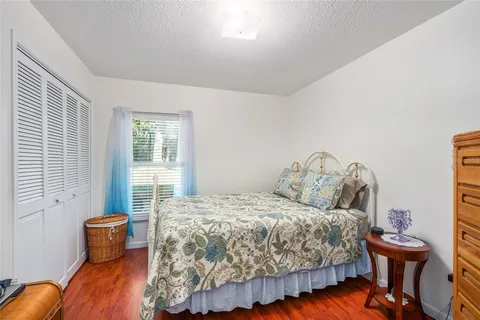 a bedroom with a bed and a table