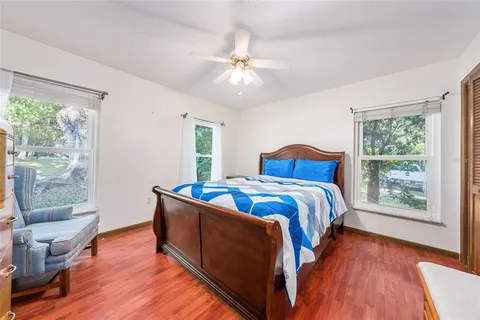 a bedroom with bed and window