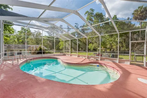 a view of a swimming pool with a patio